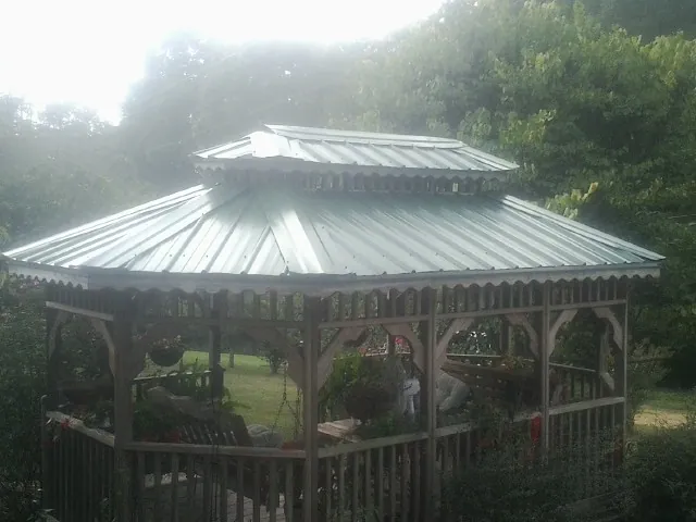 Two tier green metal roof on a garden gazebo in New Gloucester